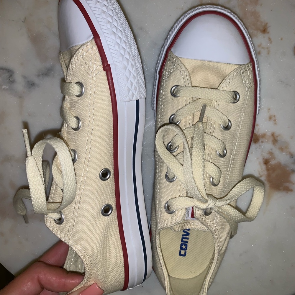Pale yellow/cream converse